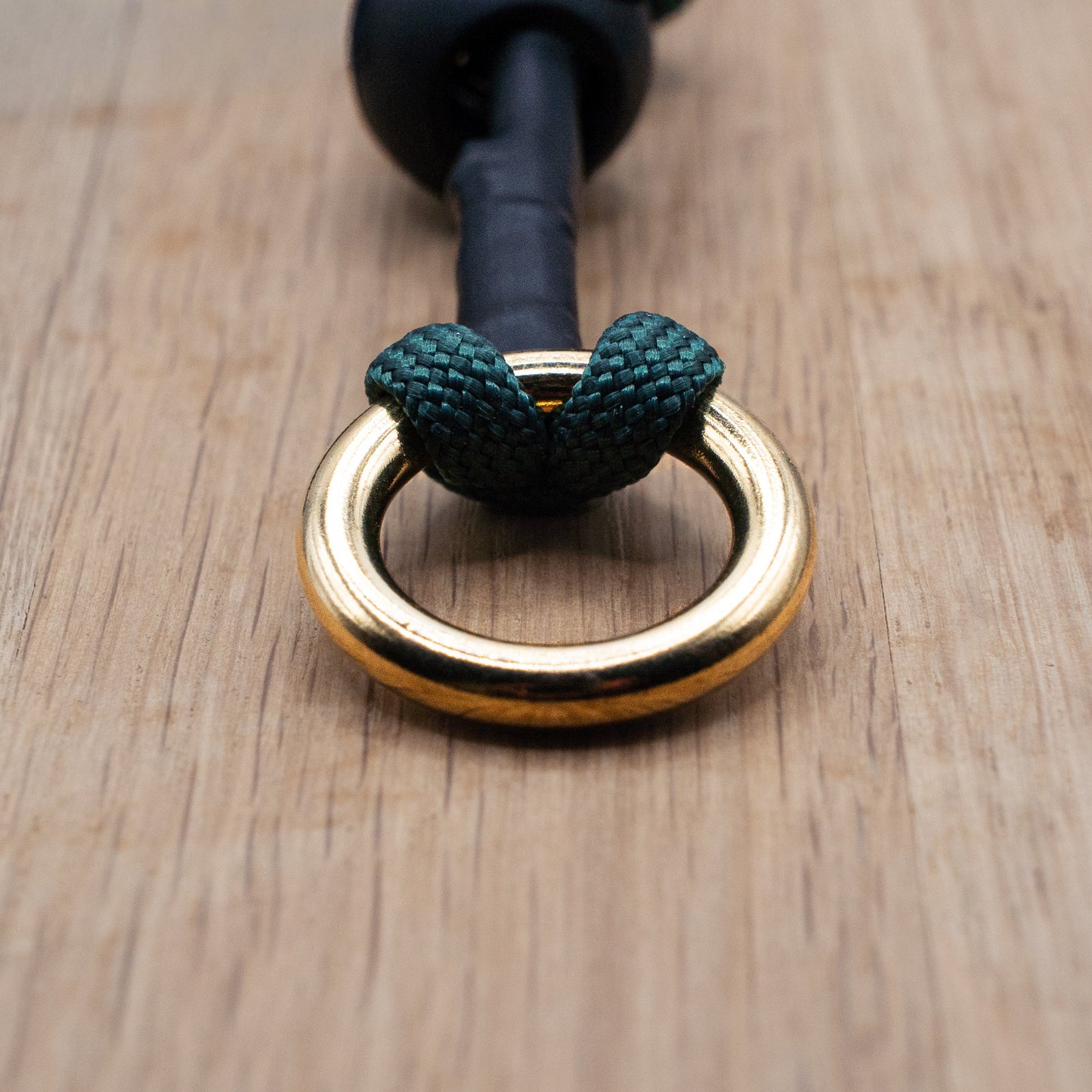 16mm solid brass 'O' Ring  featuring a double cow hitch knot to scure it to the paracord