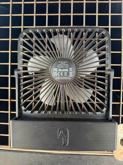 a sleek black mount to hold a warmco desk fan to the front of a dog crate